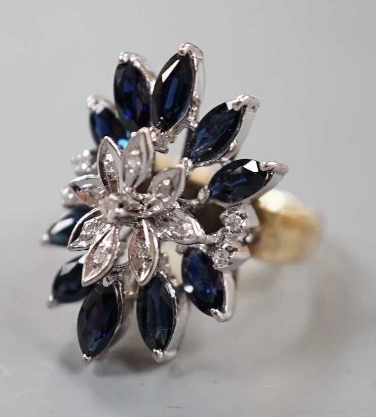 A modern 18k, sapphire and illusion set diamond chip set cluster dress ring, size K, gross weight 8.1 grams.